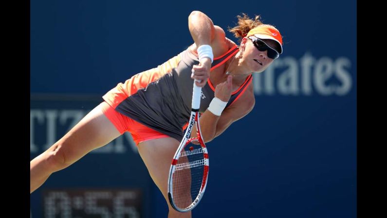 Samantha Stosur of Australia serves against Varvara Lepchenko of the United States during a women's singles third round match.