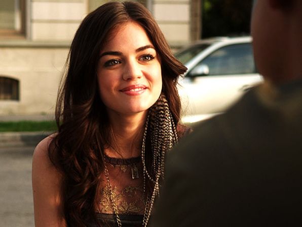 "I had just started the show, and I wanted every outfit to have my signature on it," Line said. Because Aria's outfit seemed "too tame," Line said, she took this feather earring out of her ear and put it right into Aria's.