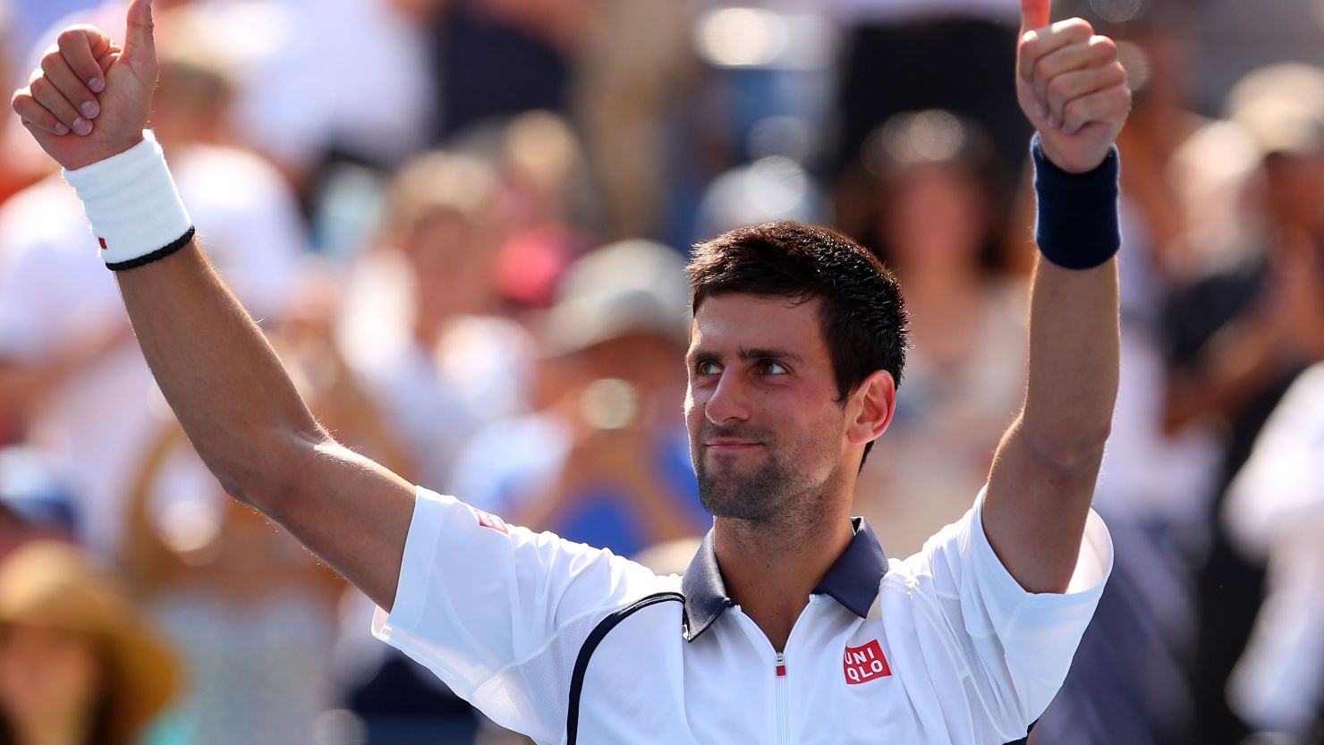 Novak Djokovic takes the applause of the crowd at Flushing Meadows after his straight sets win over Rogerio Dutra Silva 