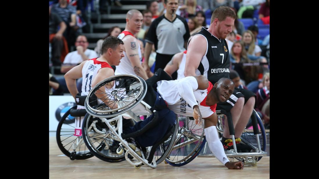 Great Britain's Ade Oregbemi takes a tumble in the preliminary men's wheelchair basketball match, which Germany won 77-72, on Thursday, August 30.
