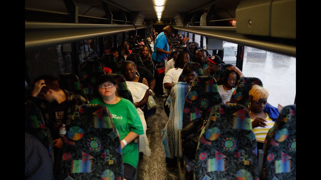 Residents sit on a bus Thursday after evacuating Laplace, Louisiana.