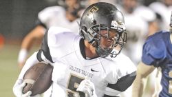 This October 2014 photo shows Shane Tamura (5) during a football game.