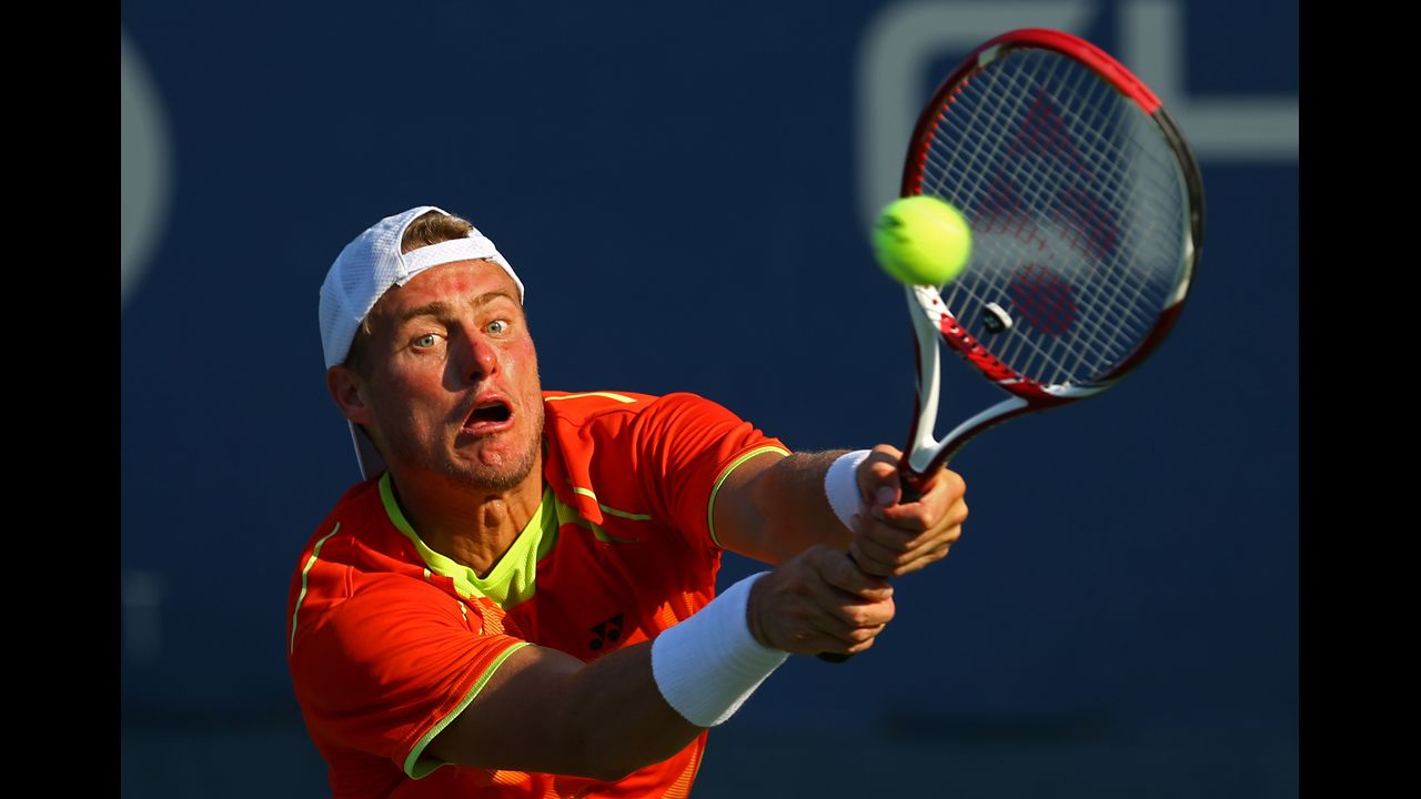 Australia's Lleyton Hewitt returns a shot to Luxembourg 's Gilles Muller in a men's singles second-round match.