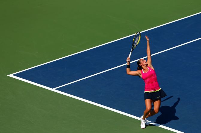 Roberta Vinci of Italy serves against Dominika Cibulkova of Slovakia during a women's singles third-round match.