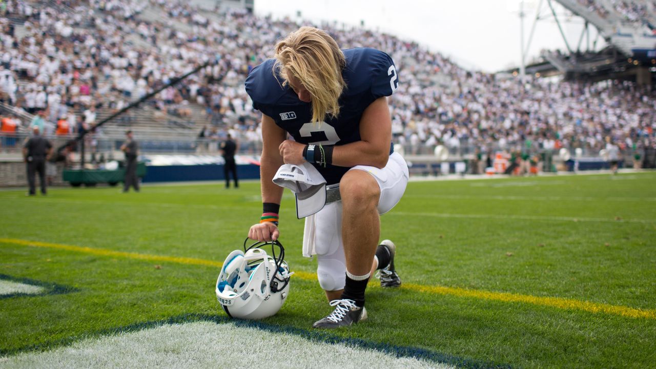 Penn State's Shane McGregor kneels in prayer following the Nittany Lions' loss to Ohio University at Beaver Stadium in State College, Pennsylvania, on Saturday, September 1. The final score was 24-14.