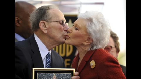 Eunice David gives her husband a kiss as the Hollywood Chamber of Commerce honors him with a star on the Hollywood Walk of Fame on October 14, 2011. It was his 90th birthday.