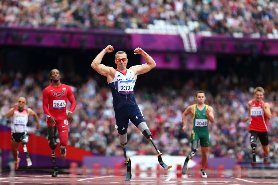 Richard Whitehead of Great Britain celebrates winning gold in the men's 200-meter T42 final.