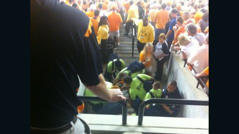 Medical personnel tend to Isaac Grubb after his fall.