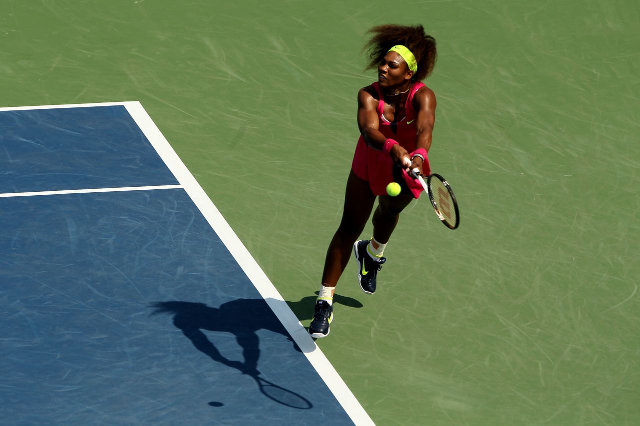 Serena Williams of the United States returns a shot against Russia's Ekaterina Makarova in their third-round singles match.