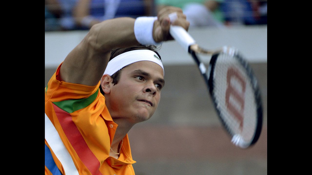Milos Raonic of Canada serves in his match against James Blake of the United States.