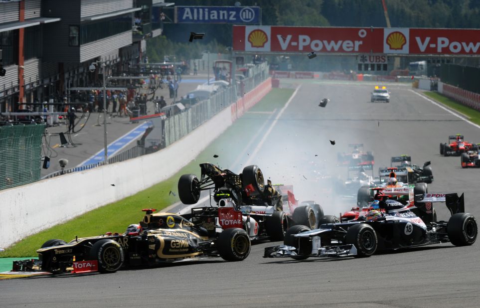 Grosjean's Lotus is flipped upwards after the initial collision and is about to be catapulted into the air.