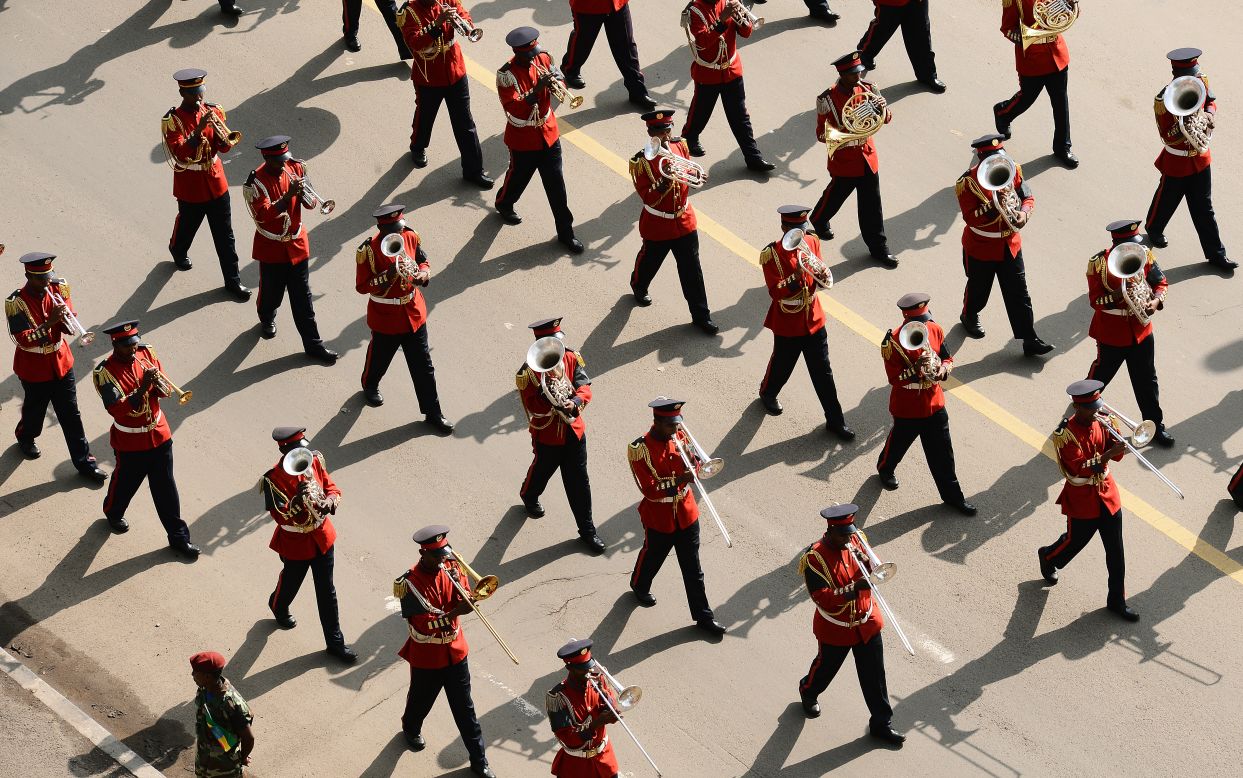 A marching band plays as the cortege moves through the streets of Addis Ababa.