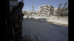 Image #: 19212391    A Free Syrian Army fighter hides in a building during a shootout with snipers on a street at El Amreeyeh neighbourhood of Syria's northwestern city of Aleppo September 1, 2012. REUTERS/Youssef Boudlal (SYRIA - Tags: POLITICS CIVIL UNREST)       REUTERS /YOUSSEF BOUDLAL /LANDOV