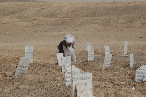 A man visits a Taliban cemetery in the Arghandab district outside Kandahar city. The Taliban fighters who get killed in attacks are usually brought here by the International Committee of the Red Cross.