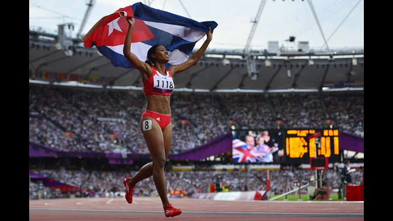 Cuba's Omara Durand celebrates after taking the gold medal in the women's 400-meter final.