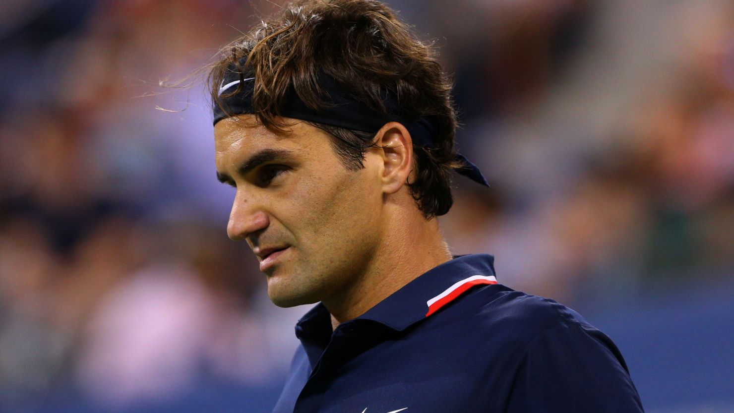 Roger Federer is through to the quarterfinals of the U.S. Open after his last 16 opponent, Mardy Fish withdrew