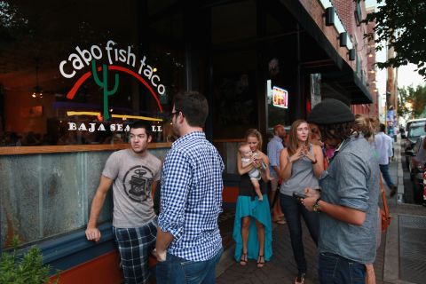Diners wait to get in at Cabo Fish Taco in Charlotte's NoDa district. Businesses in Charlotte are anticipating a boost in sales when the city hosts the DNC.
