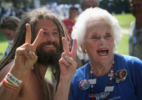 Charlotte Gardner, 86, poses for a picture with Aneheim James, a protester from California, after she marched with the Democratic Women of Mecklenburg County in the Charlotte Labor Day Parade on Monday.