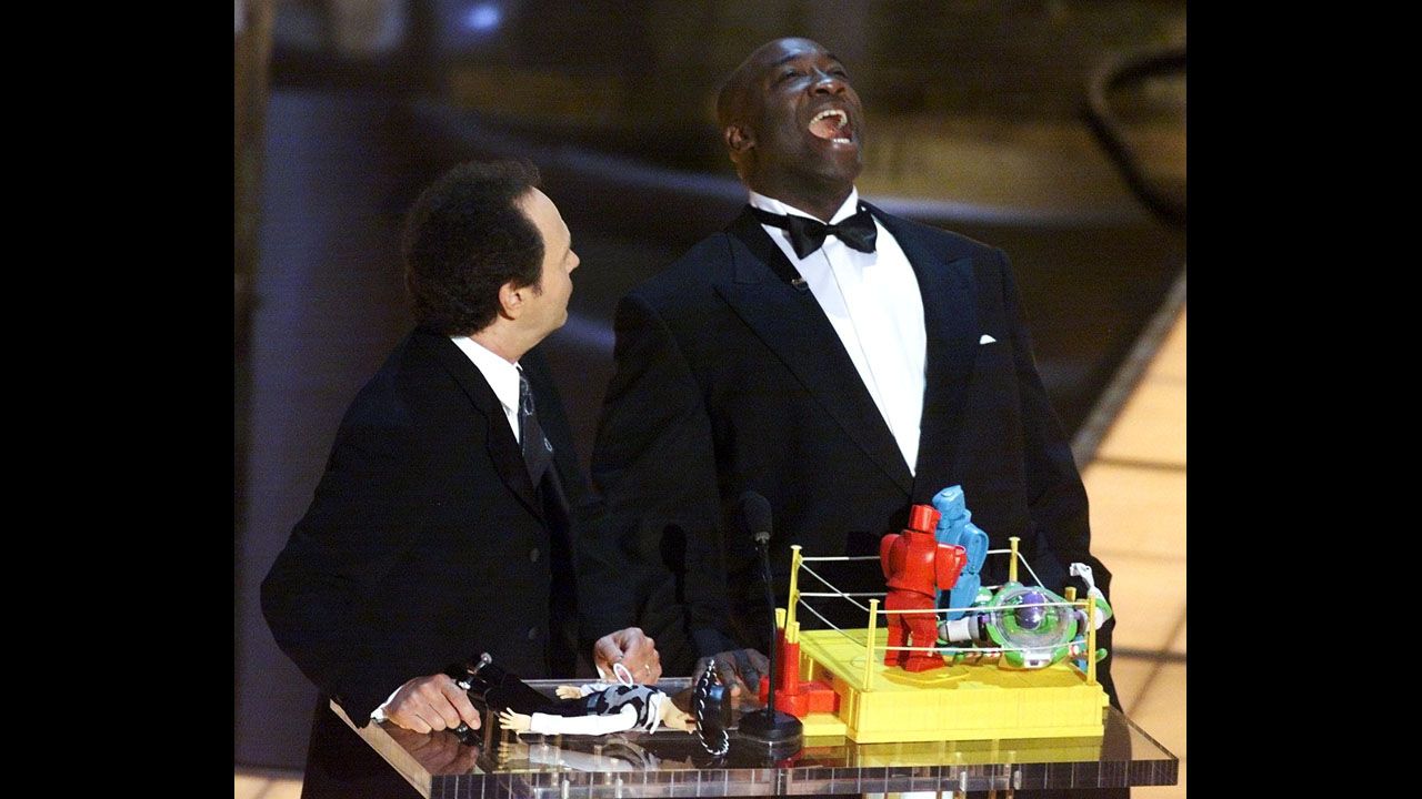 Academy Awards host Billy Crystal and Duncan present the animated action short film award during the ceremony in 2000.