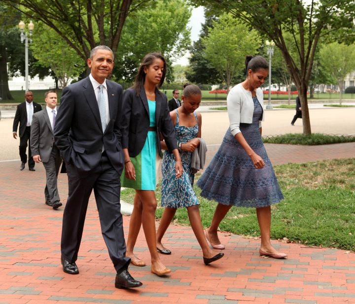 The first family walks across Lafayette Park to attend Sunday services in Washington in August 2012. 