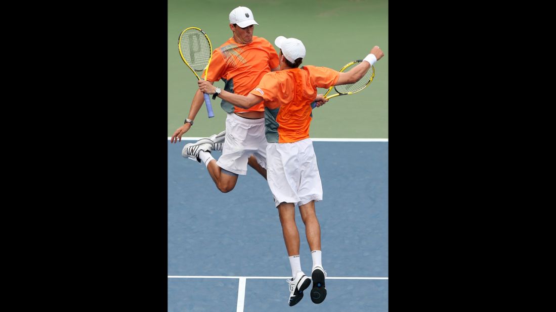 Mike Bryan, right, and Bob Bryan of the United States bump chests in celebration during their doubles match against Santiago Gonzalez of Mexico and Scott Lipsky of the United States on Monday.
