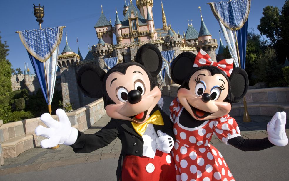 3. There's nothing like visiting the original Disneyland, featuring Mickey and Minnie Mouse in front of Sleeping Beauty Castle in Anaheim, California.