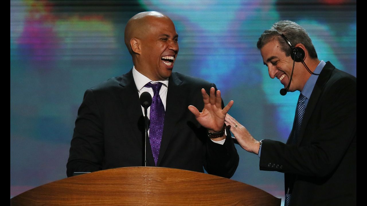 Newark Mayor Cory Booker, left, laughs with stage manager David Cove during a walk-through on Tuesday.