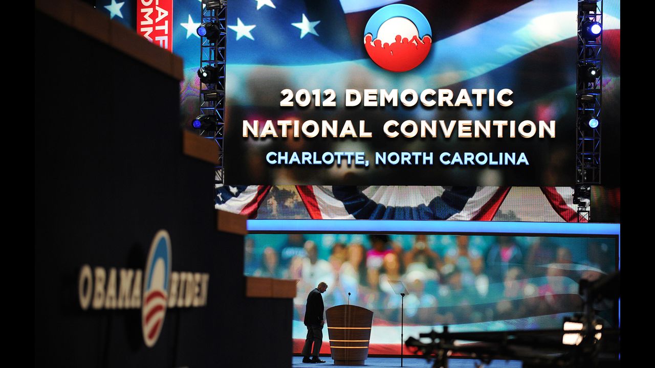 A worker checks the stage hours before the start of the convention on Tuesday.