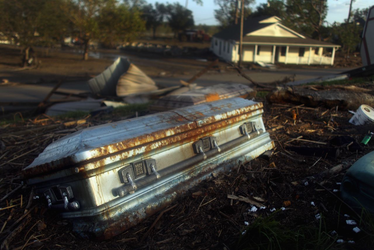 A coffin lies on the side of a levee Monday in Braithwaite, Louisiana, washed up by floodwaters from Hurricane Isaac.