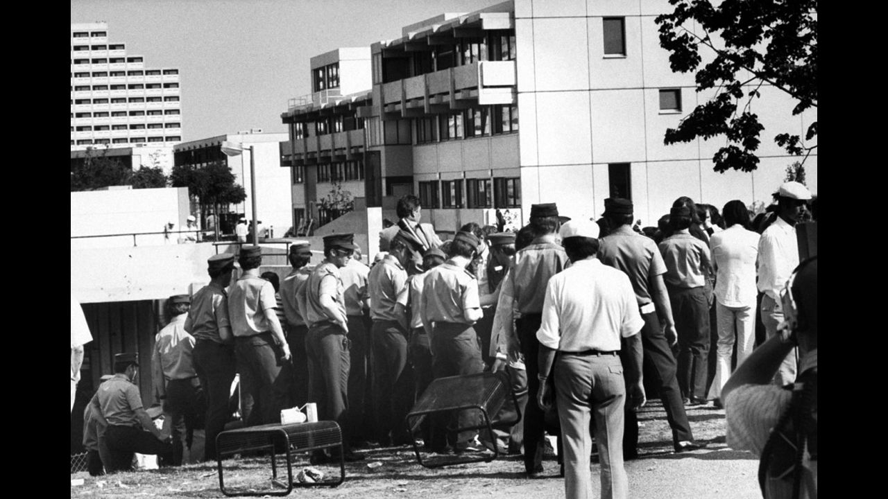 With terrorists holed up in the Israeli athletes' quarters, swarms of German policemen, in uniform and plain clothes, move in and seal off the area, Munich, September 1972.