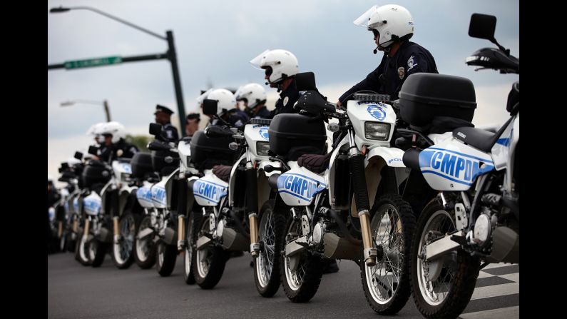 Law enforcement officers prepare to face off with protesters during a march outside the Charlotte Convention Center on Tuesday.