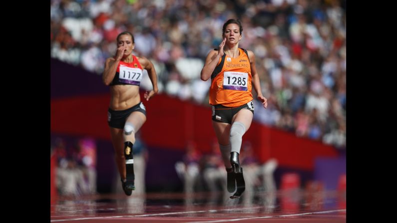 Katrin Green, left, of Germany and Marlou van Rhijn of the Netherlands compete in the women's 200-meter T37 heats at Olympic Stadium on Wednesday.