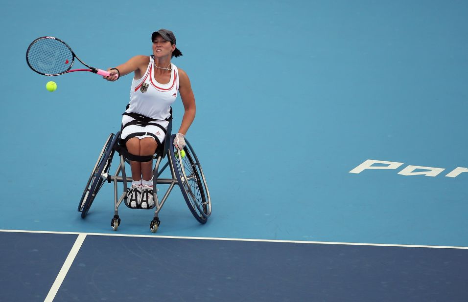 Katharina Kruger of Germany plays a shot while competing with Sabine Ellerbrock against Jordanne Whiley and Lucy Shuker of Great Britain during the women's doubles wheelchair tennis quarterfinal match on Tuesday.