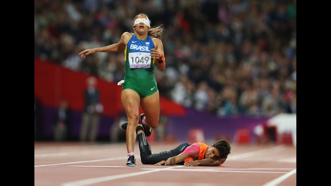 Brazilian Terezinha Guilhermina loses her guide Guilherme Soares de Santana after he fell in the Women's 400-meter  T12 final at the 2012 London Paralympic Games on Tuesday, September 4.