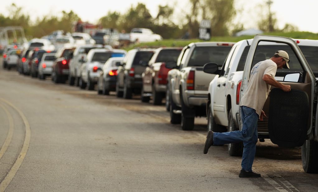 Returning residents wait in line Tuesday for a ferry in Plaquemines Parish.