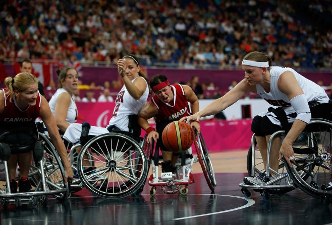 Natalie Schneider of the United States reaches for the ball in the women's wheelchair basketball quarterfinals against Canada on Tuesday.
