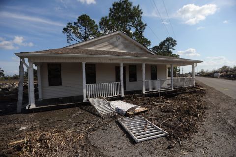 A home washed away from its foundation sits on a roadside Tuesday in Braithwaite in Plaquemines Parish.