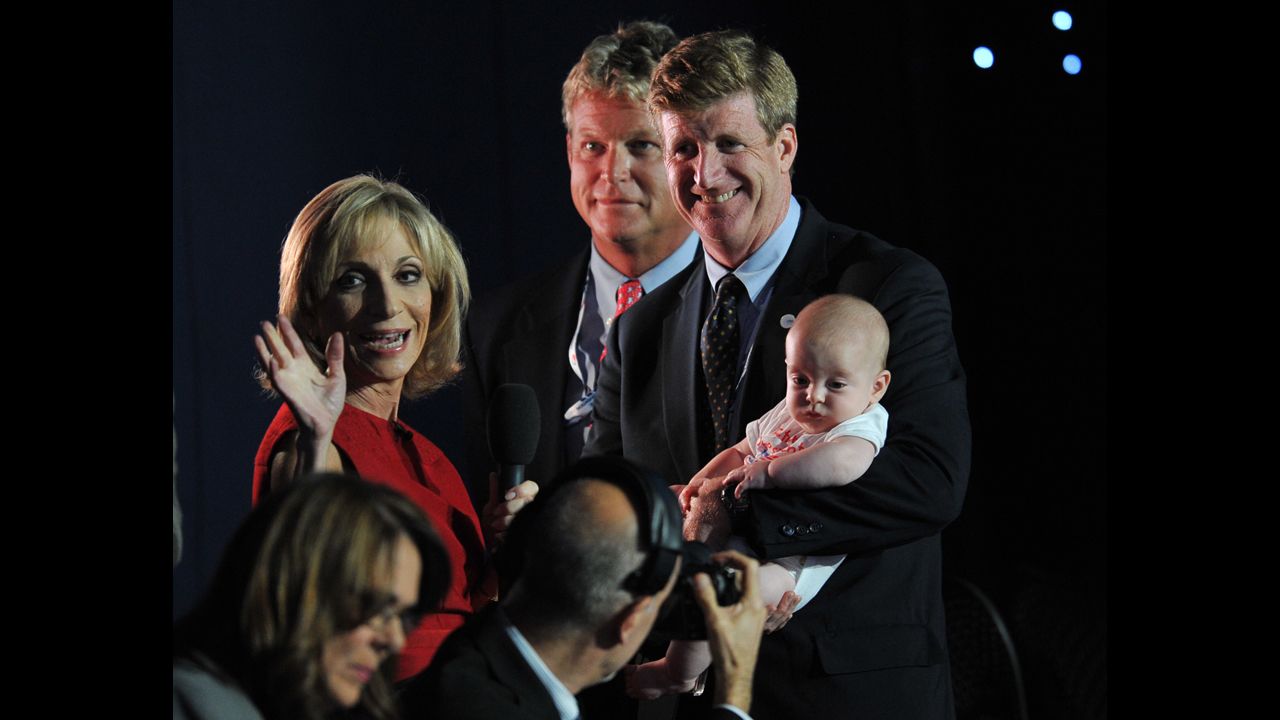 Former Rep. Patrick Kennedy holds his child as he speaks to the media Tuesday. He is a son of the late Sen. Ted Kennedy.