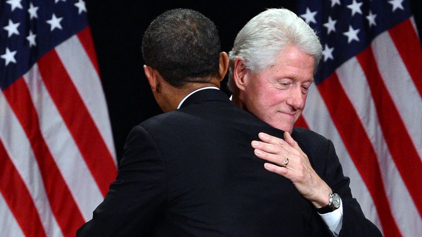 US President Barack Obama embraces former President Bill Clinton during a campign event in New York on June 4, 2012. Obama is perched on a economic and political cliff edge: to one side lies solid ground and four more White House years, to the other, a plunge to defeat after a single term. Dismal jobs data, a slowing economy and fears that Europe's crisis will darken American skies came as a sickening blow last week to Obama's campaign, five months before election day on November 6. AFP PHOTO/Jewel Samad        (Photo credit should read JEWEL SAMAD/AFP/GettyImages)