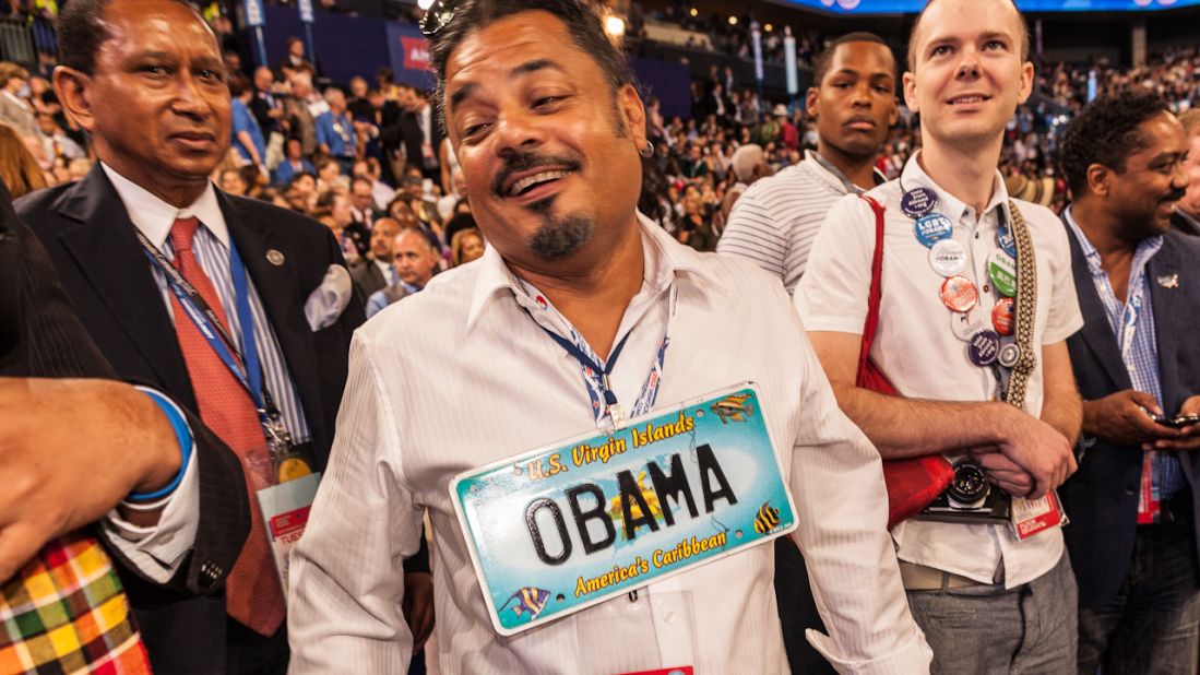 Robert Rios of the Virgin Islands wears a President Obama license plate Tuesday.