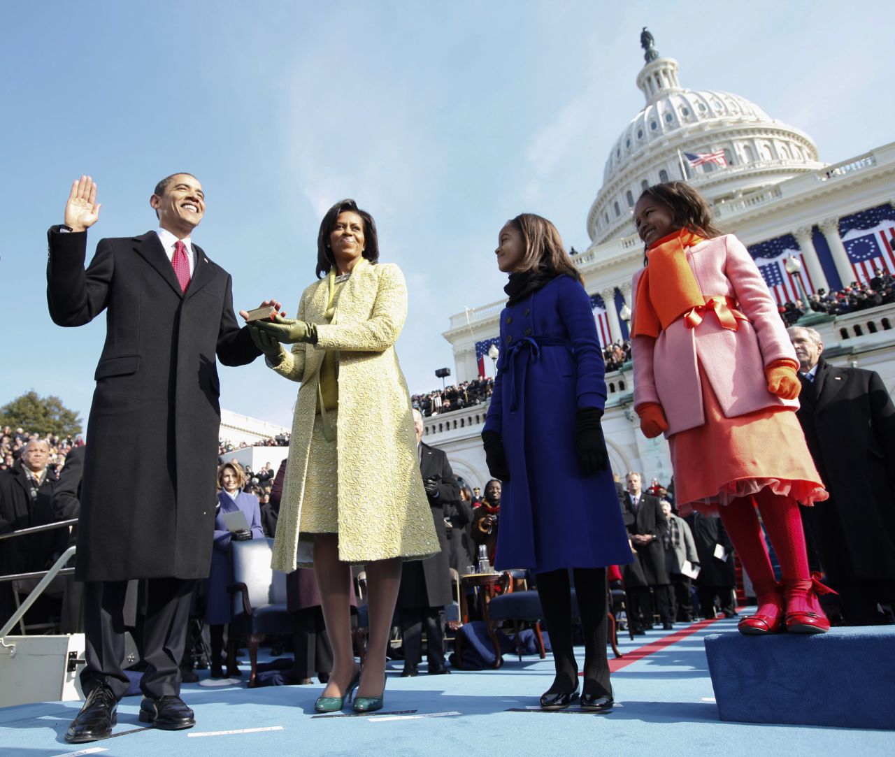 Obama takes the oath of office with his family by his side on January 20, 2009, at the US Capitol. Sasha is at far right, next to Malia.