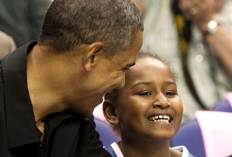 President Obama and Sasha watch a WNBA game in Washington in August 2010.
