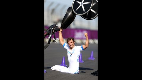 Alessandro Zanardi of Italy celebrates winning the men's individual H4 time trial on Wednesday.