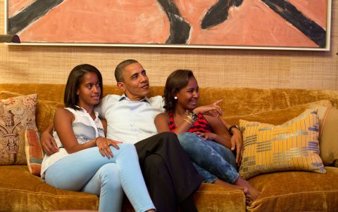 The President and his daughters watch on television as the first lady gives a speech at the Democratic National Convention in September 2012.