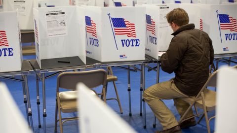The Justice Department approved a law requiring New Hampshire voters to provide photo ID at the polls. 
