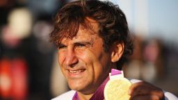 Alex Zanardi proudly displays the gold medal he won at the 2012 London Paralympics in the Individual H4 Time Trial.