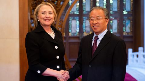 Hillary Clinton shakes hands with Chinese State Councilor Dai Bingguo in Beijing on Wednesday, day two of the DNC.