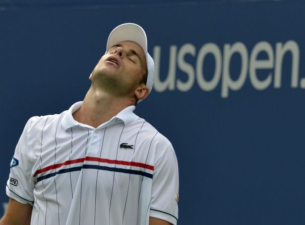 Andy Roddick shows the strain of defeat as he loses to Juan Martin Del Potro in the final match of his career.