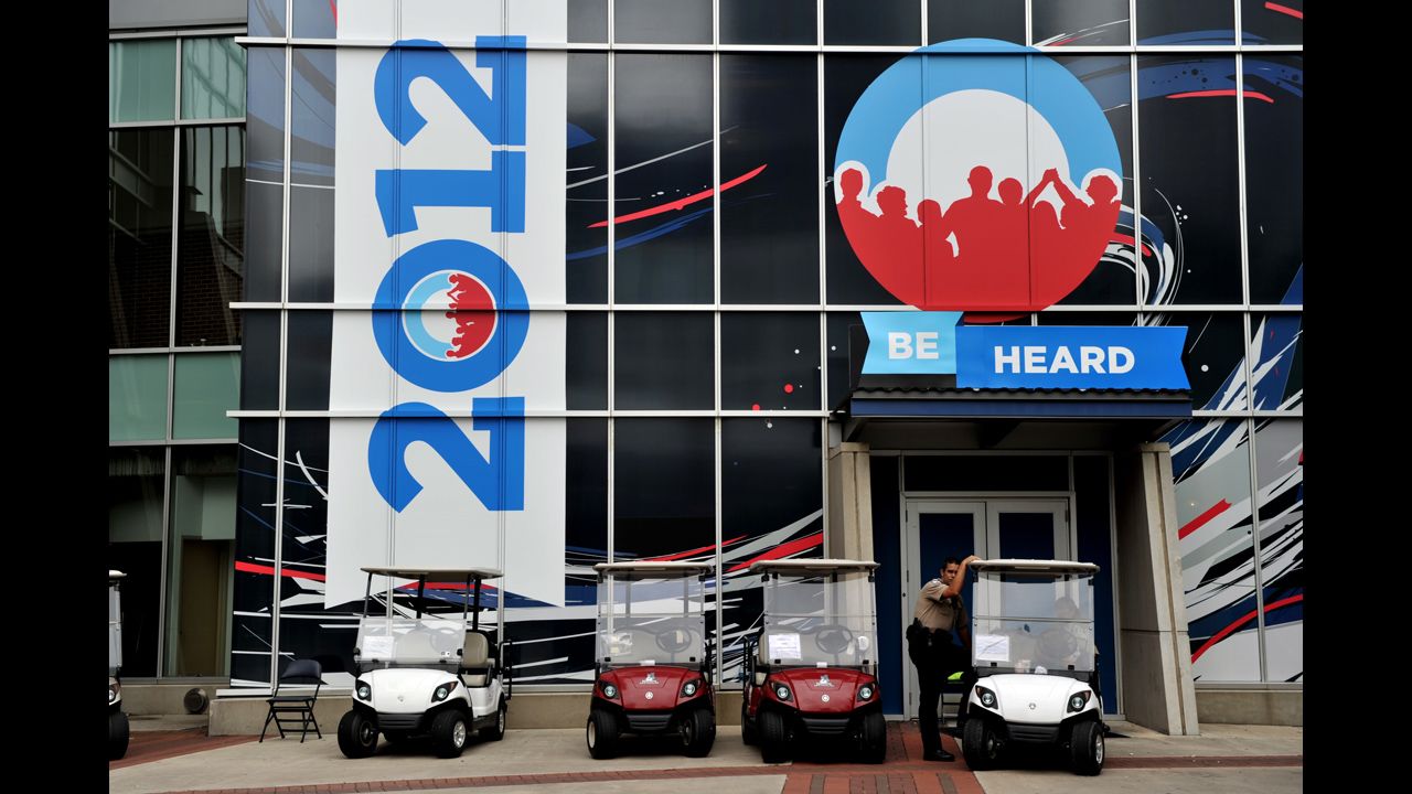 A police officer stands near golf carts outside the Time Warner Cable Arena on Wednesday.