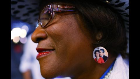 Delegate Gloria Goodwin wears earrings depicting President Barack Obama and first lady Michelle Obama on Wednesday.